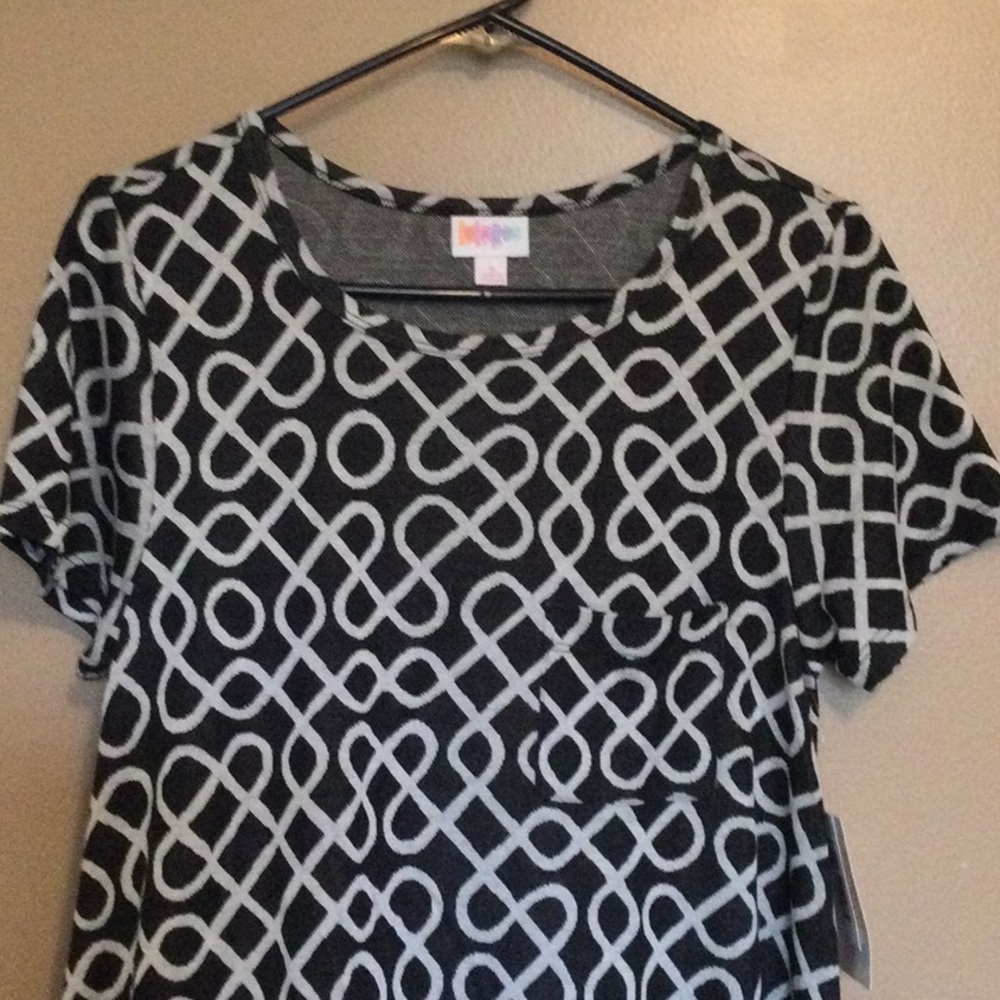 New with tags Lularoe Carly Dress, size Small. Black with white wavy lines